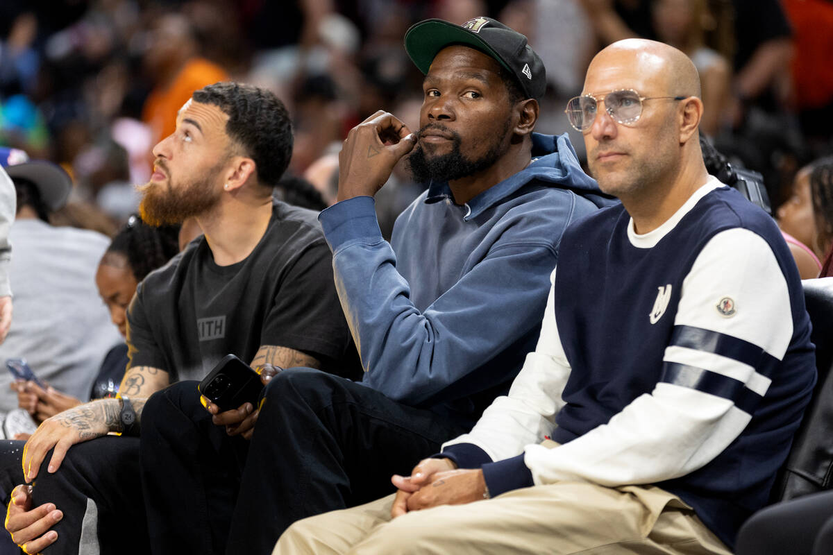 Kevin Durant, NBA player for the Phoenix Suns, center, attends the WNBA All-Star basketball gam ...