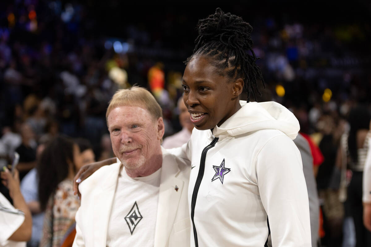 Las Vegas Aces owner Mark Davis, left, hugs Aces guard Chelsea Gray after she played in the WNB ...