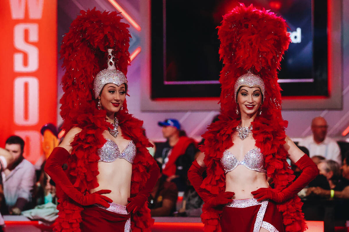 Showgirls pose on set for the $10,000 buy-in No-limit Hold’em World Championship at the ...