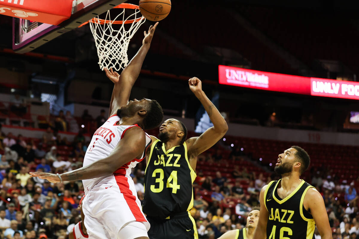Houston Rockets forward Darius Days (5) goes in for a layup around Utah Jazz center Nick Ongend ...