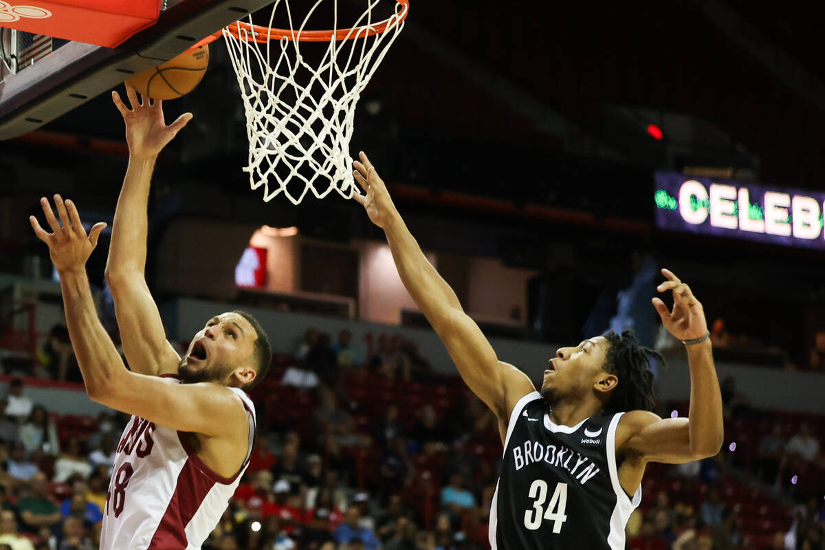 Cleveland Cavaliers forward Pete Nance (48) shoots a layup around Brooklyn Nets guard Kennedy C ...