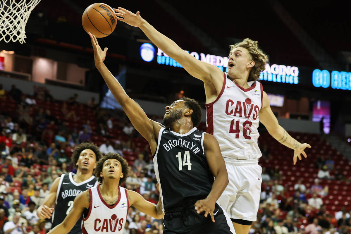 Cleveland Cavaliers forward Luke Travers (46) attempts to block Brooklyn Nets guard Matt Lewis ...