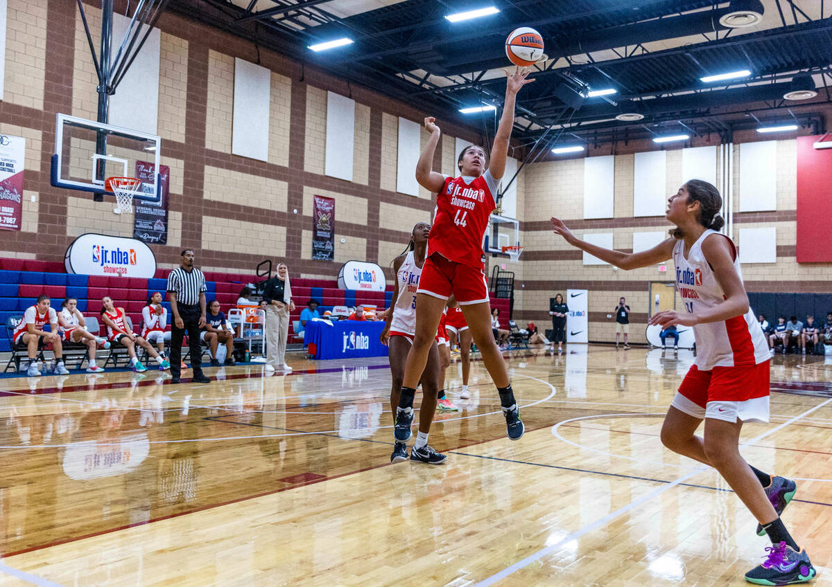 Nation Williams (44), center, elevates for a basket as Zeina Haleem (34) arrives late during a ...