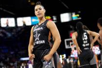 The Las Vegas Aces’ Kelsey Plum, of Team Wilson, flexes for cameras during the second ha ...