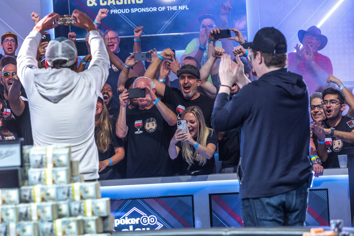 Daniel Weinman shows a new Jostens bracelet while joined by his supporters after winning the Wo ...