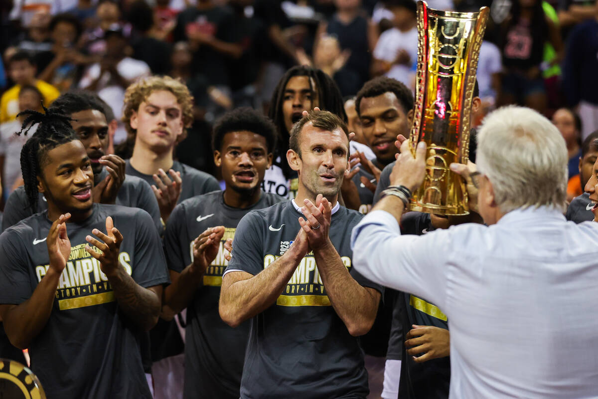 The Cleveland Cavaliers are presented a trophy for winning the NBA Summer League championship g ...