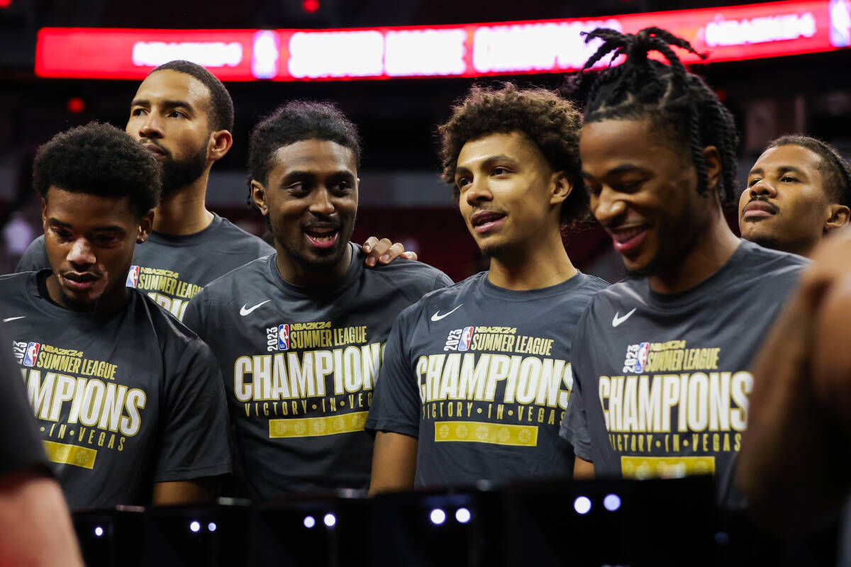 Cleveland Cavaliers players celebrate after winning the NBA Summer League championship game aga ...