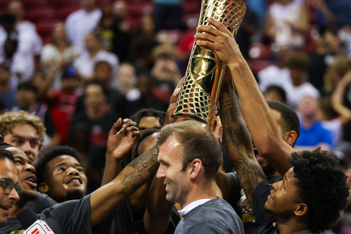 The Cleveland Cavaliers lift up their trophy after winning the NBA Summer League championship g ...