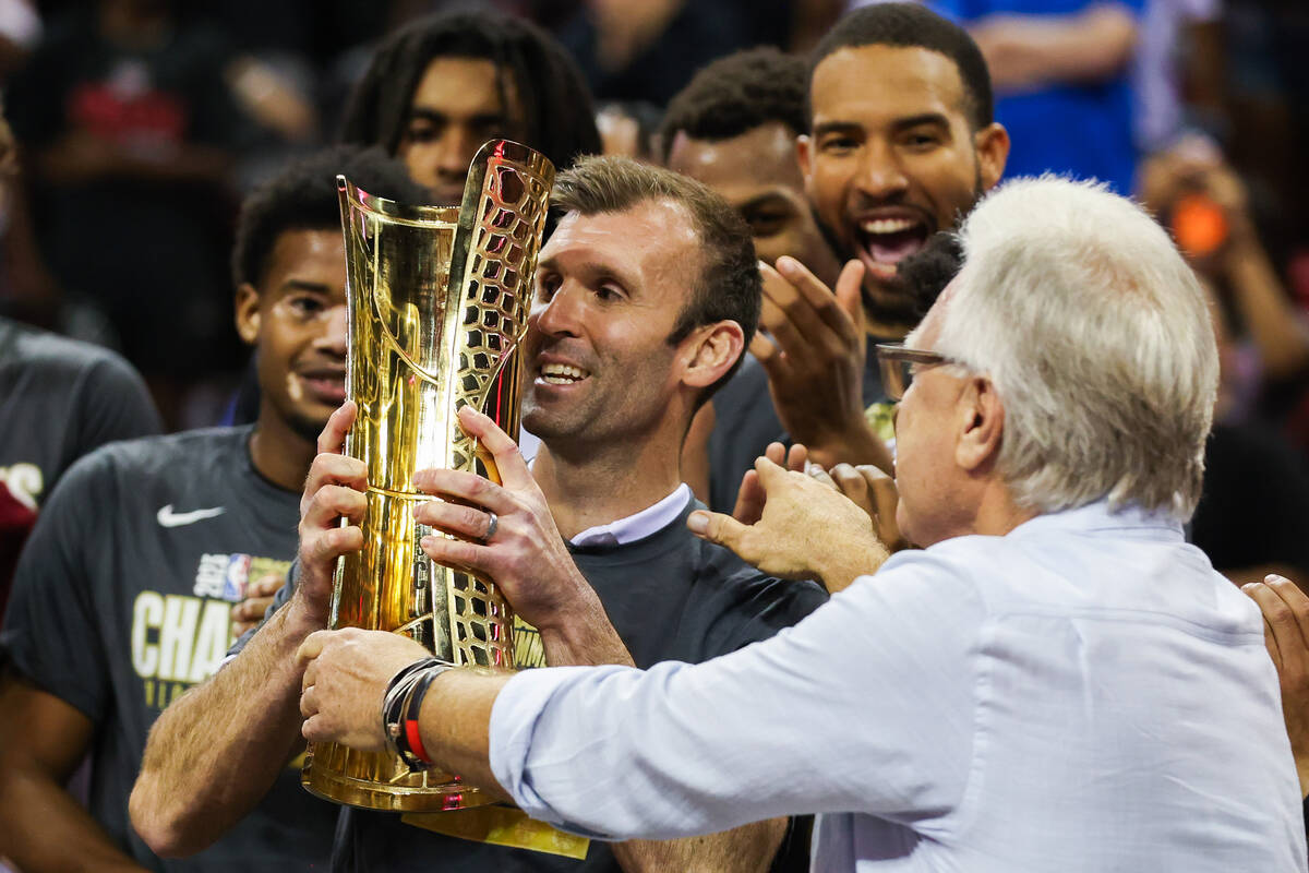 Mike Gerrity, Cleveland Cavaliers head coach for the summer league season, is presented with th ...