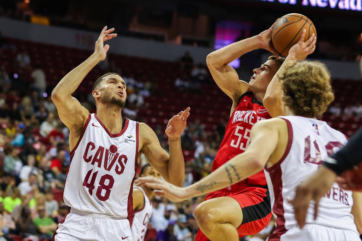 Houston Rockets guard Fletcher Magee (55) shoots the ball while Cleveland Cavaliers forward Pet ...