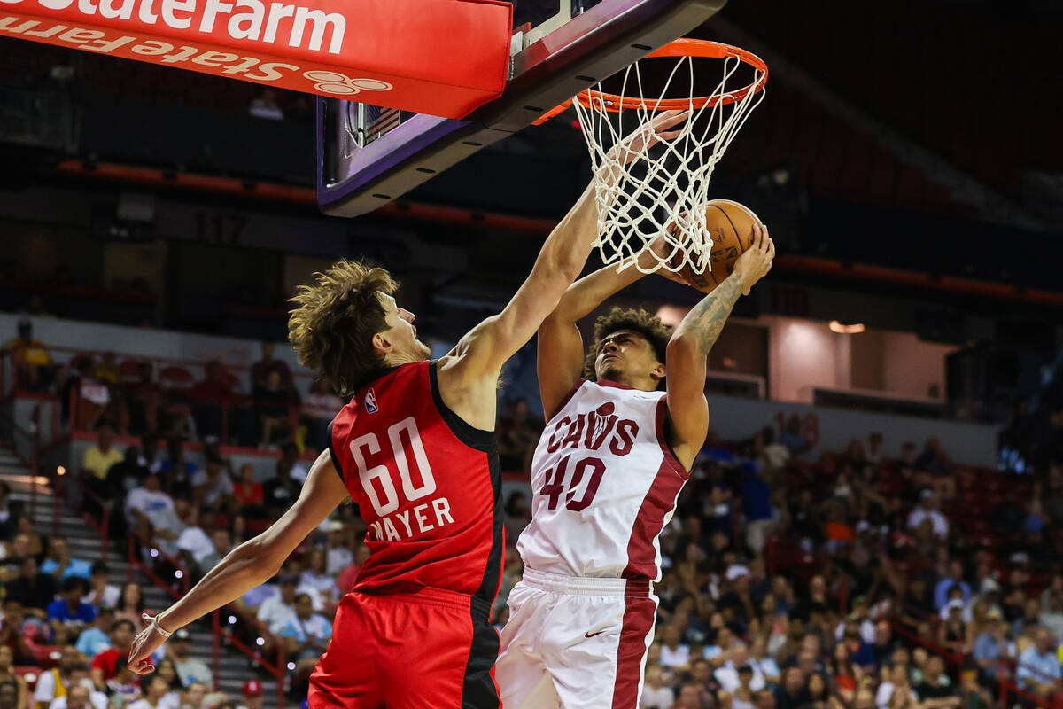 Houston Rockets forward Matthew Mayer (60) blocks Cleveland Cavaliers guard Craig Porter Jr. (4 ...