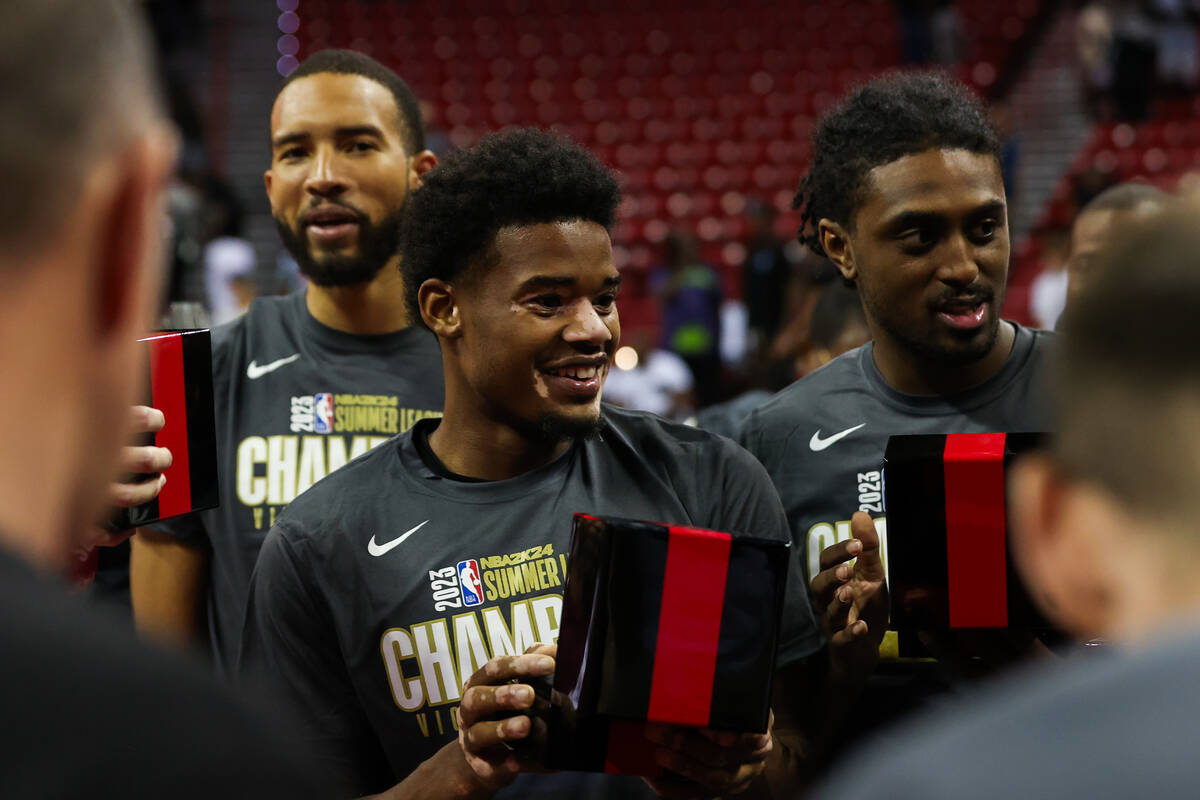 Cleveland Cavalier players hold up their new rings after winning the NBA Summer League champion ...