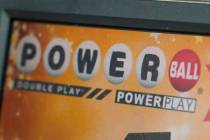 A display panel advertises tickets for a Powerball drawing at a convenience store inn November ...