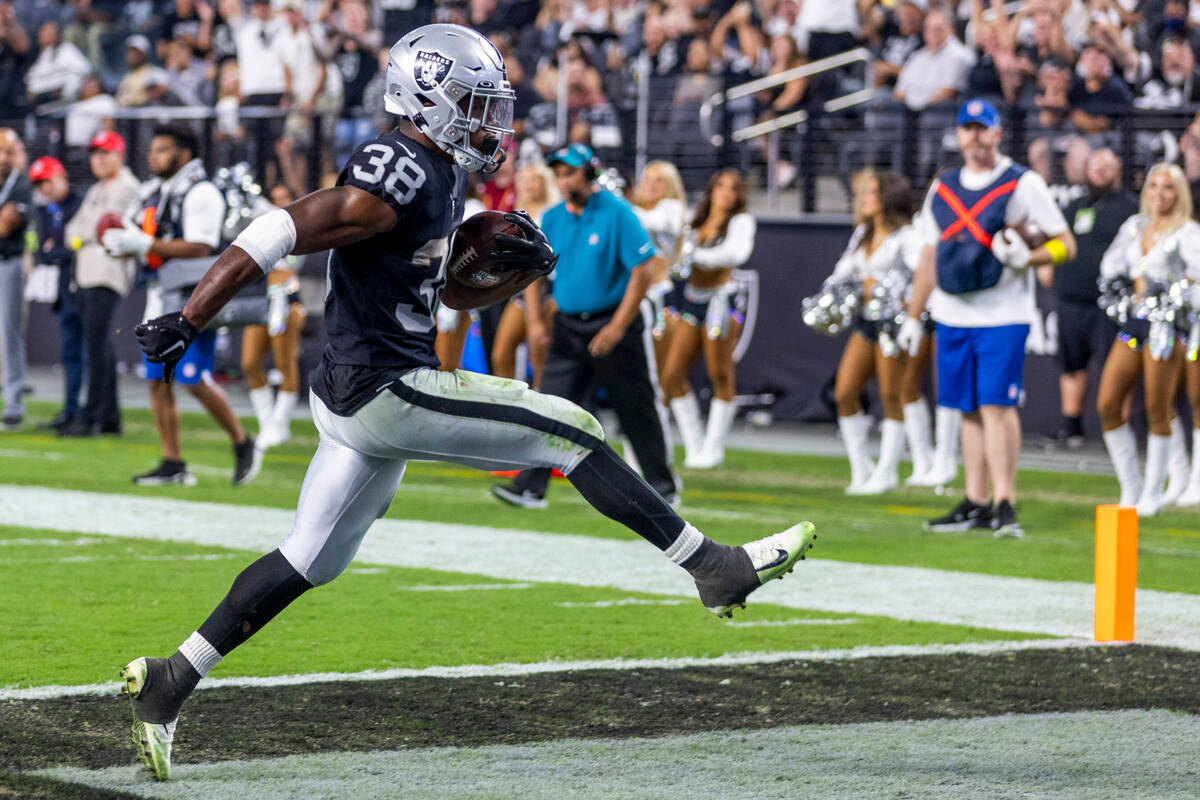 Raiders running back Brittain Brown (38) celebrates into the end zone versus the New England Pa ...