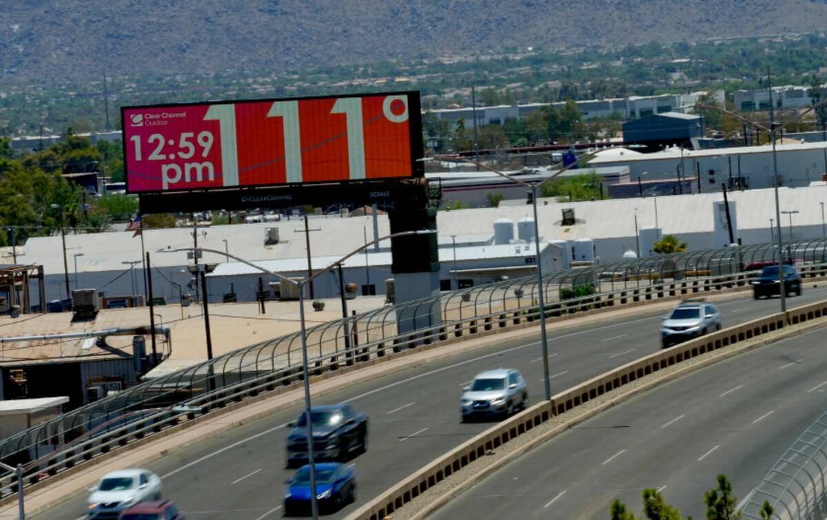 A digital billboard displays the temperature on Monday, July 17, 2023 in downtown Phoenix. (AP ...