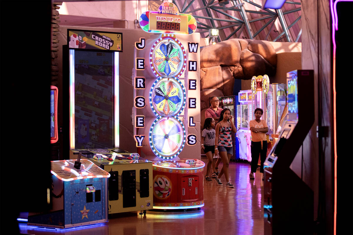 A family walks through arcade games in the Adventuredome at Circus Circus on Wednesday, July 19 ...
