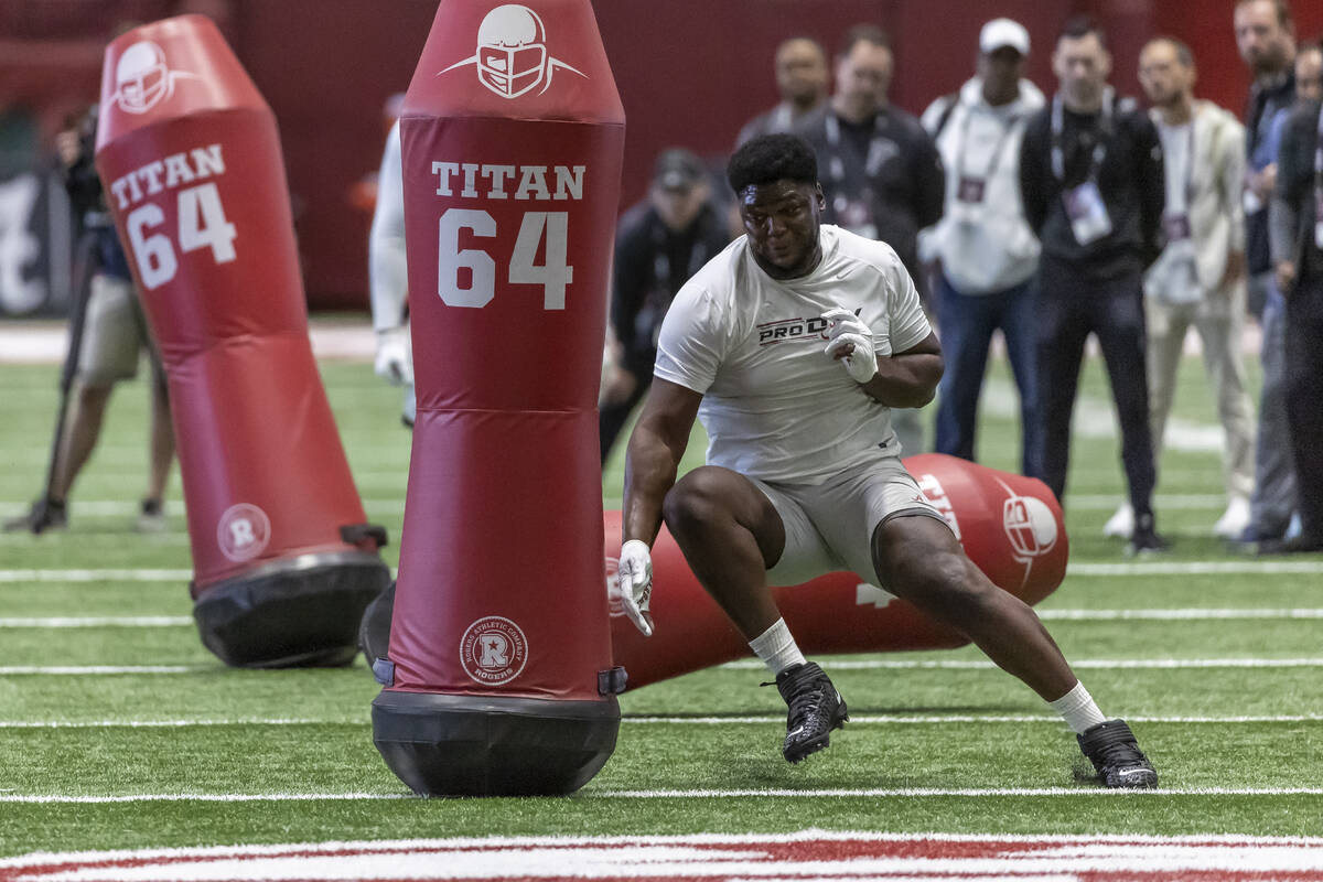 Former Alabama defensive lineman Byron Young works in position drills at Alabama's NFL pro day, ...