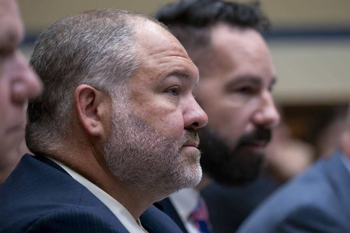 IRS Criminal Investigator Joseph Ziegler, right, and IRS Special Agent Gary Shapley appear befo ...