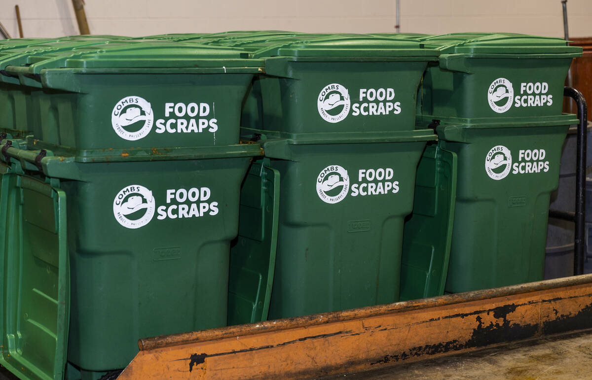 Allegiant Stadium team members collect food scraps which are then provided to a local livestock ...