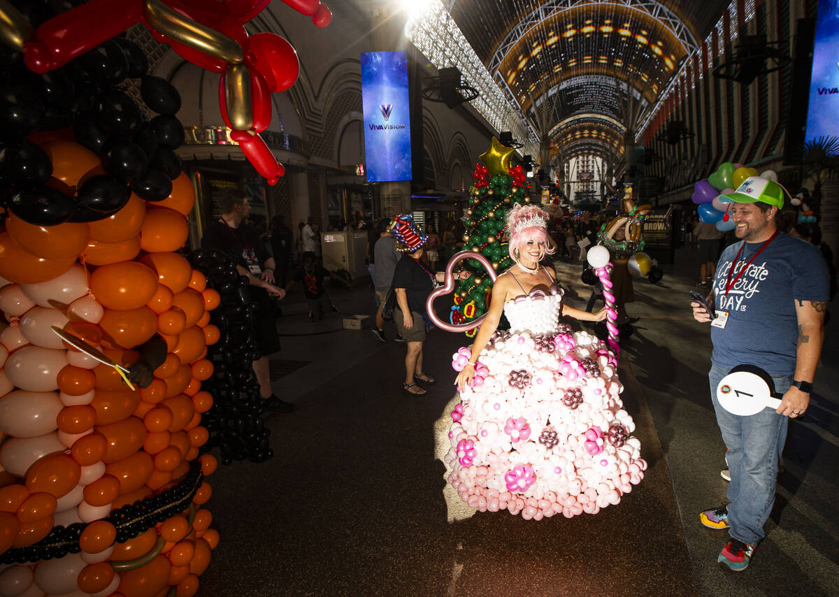 Las Vegas performer and model Yzma Mind walks in a parade led by the Bling Bling Jam balloon co ...