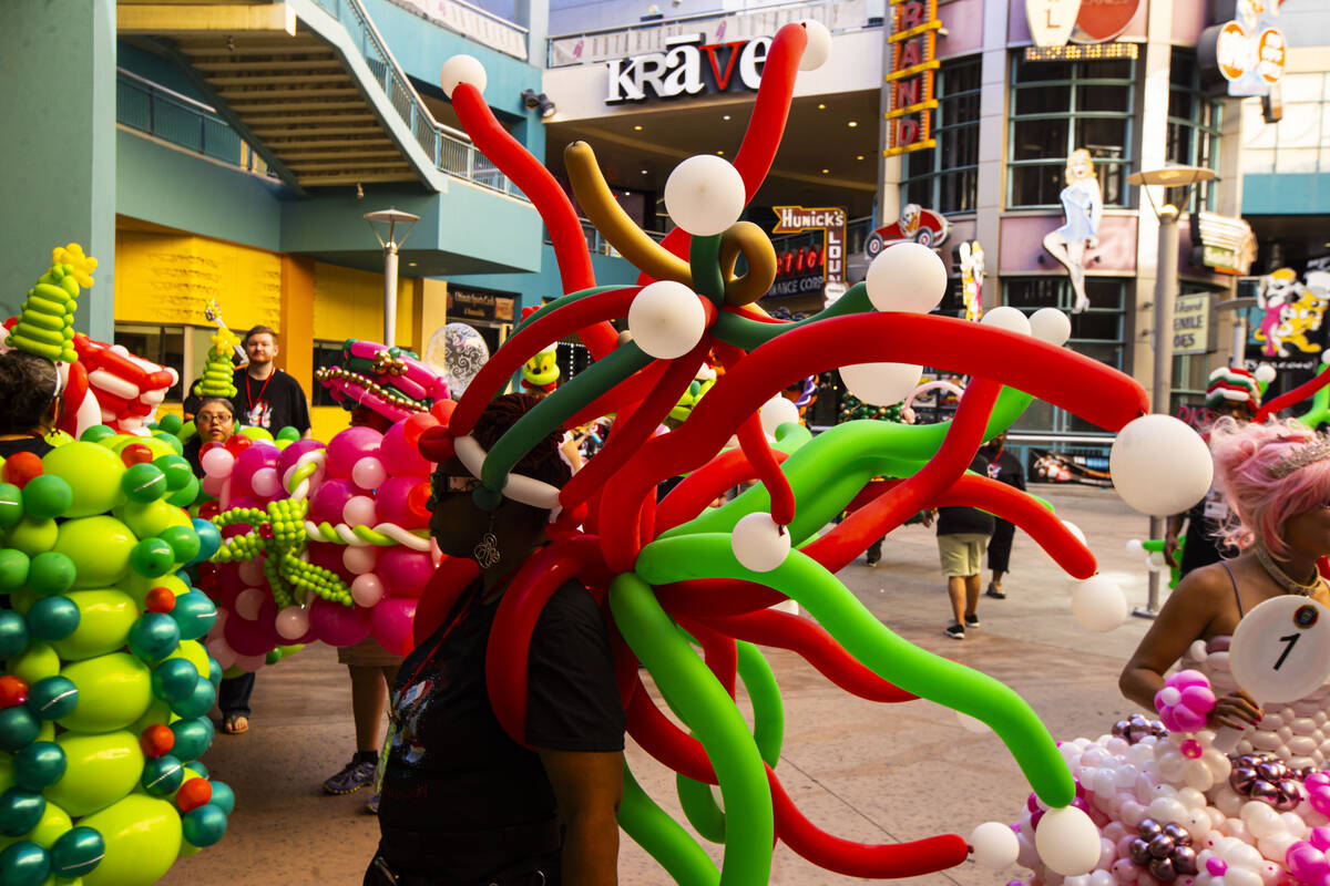 Attendees of the Bling Bling Jam balloon convention take a break at Neonopolis during their par ...