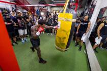 Fighter Errol Spence Jr. hits the heavy bag during a media workout day at the Fight Capital Gym ...