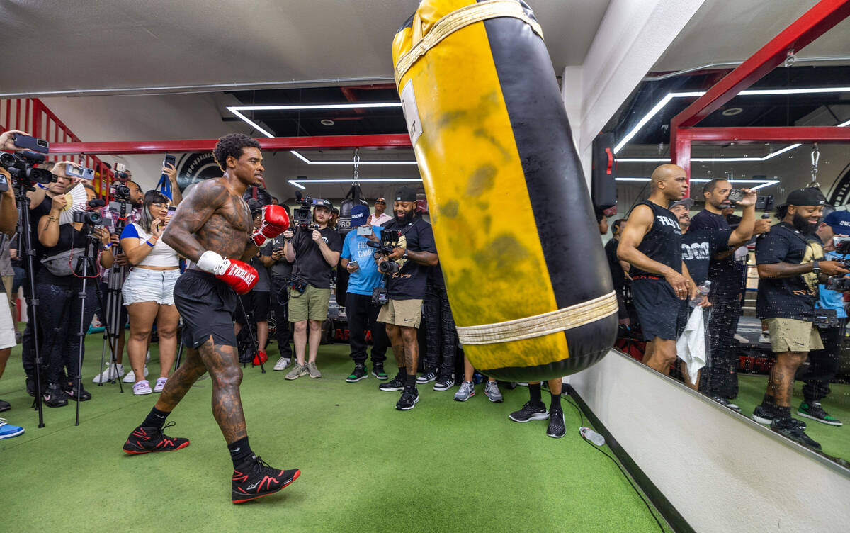Fighter Errol Spence Jr. hits the heavy bag during a media workout day at the Fight Capital Gym ...