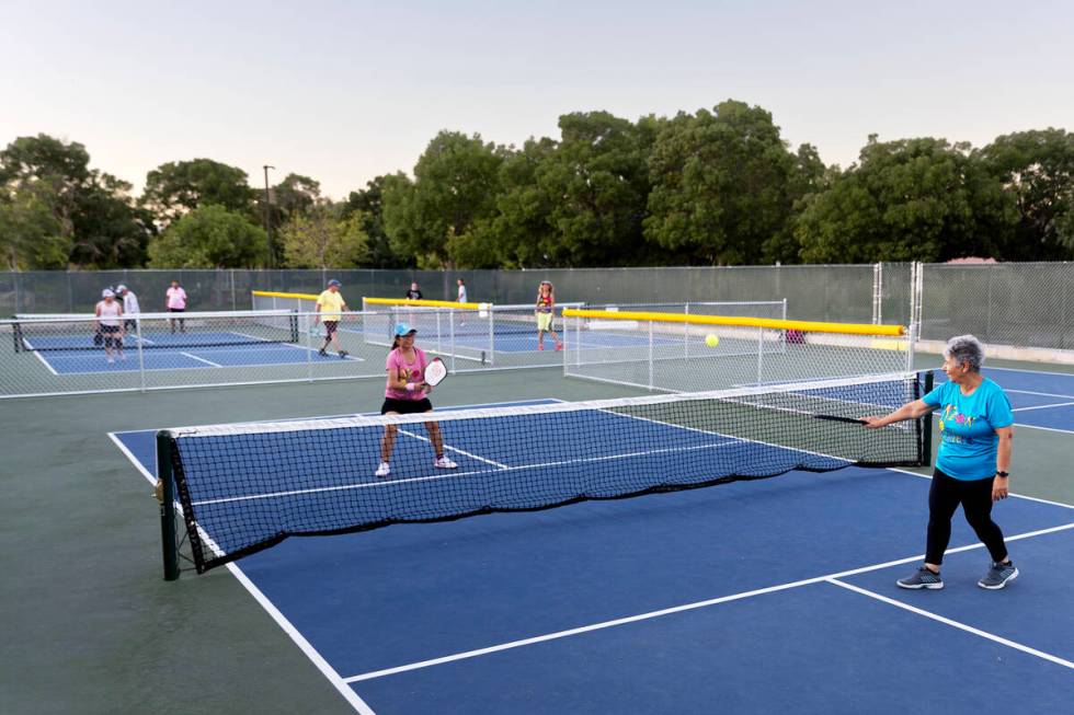 Members of the Neon Picklers play pickleball at Aloha Shores Park on July 13, 2023, in Las Vega ...