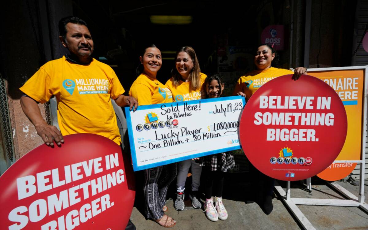 A sign is posted outside at the Las Palmitas Mini Market where the winning Powerball lottery ti ...