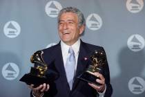 FILE - Veteran singer Tony Bennett displays his two Grammy's backstage at the Shrine Auditorium ...