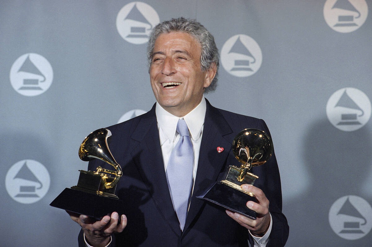 FILE - Veteran singer Tony Bennett displays his two Grammy's backstage at the Shrine Auditorium ...