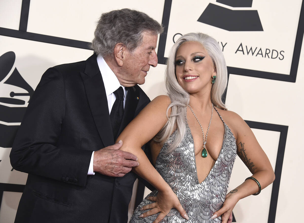 FILE - Tony Bennett, left, and Lady Gaga appear at the 57th annual Grammy Awards in Los Angeles ...