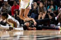 Las Vegas Aces forward Candace Parker (3) grimaces after falling to the court while Dallas Wing ...