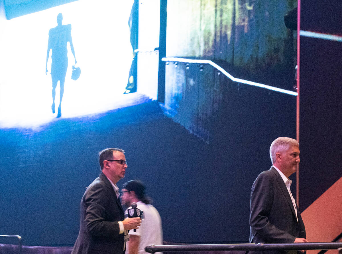 Pac-12 commissioner George Kliavkoff, right, leaves the podium after discussing the state of th ...