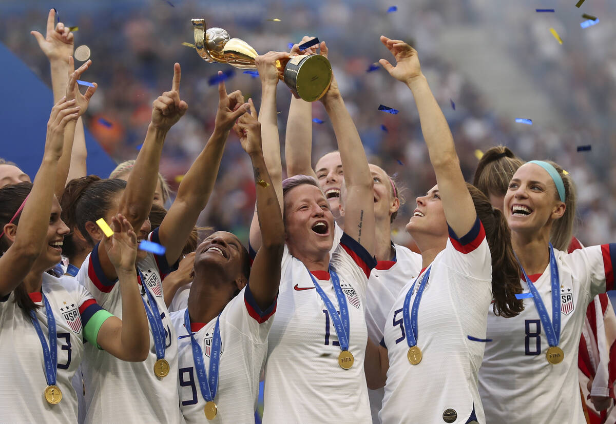 FILE - United States' Megan Rapinoe holds the trophy celebrating at the end of the Women's Worl ...