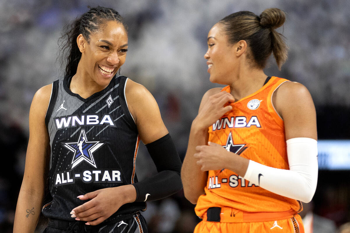 Las Vegas Aces' A'ja Wilson, of Team Wilson, laughs with Minnesota Lynx's Napheesa Collier, of ...