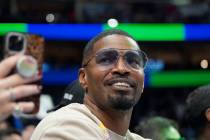 FILE - Jamie Foxx smiles during an NBA basketball game between the Washington Wizards and Dall ...
