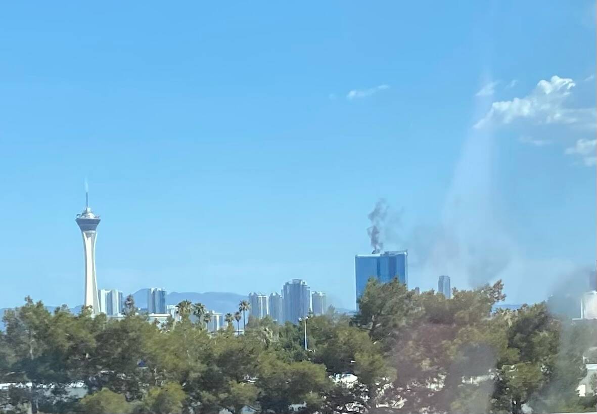 A black plume of smoke is seen on the roof of the Fontainebleau luxury hotel in Las Vegas on Sa ...