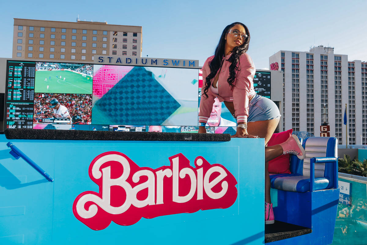 Shay Mareno poses at one of the Barbie photo ops that were set up at Stadium Swim in honor of t ...