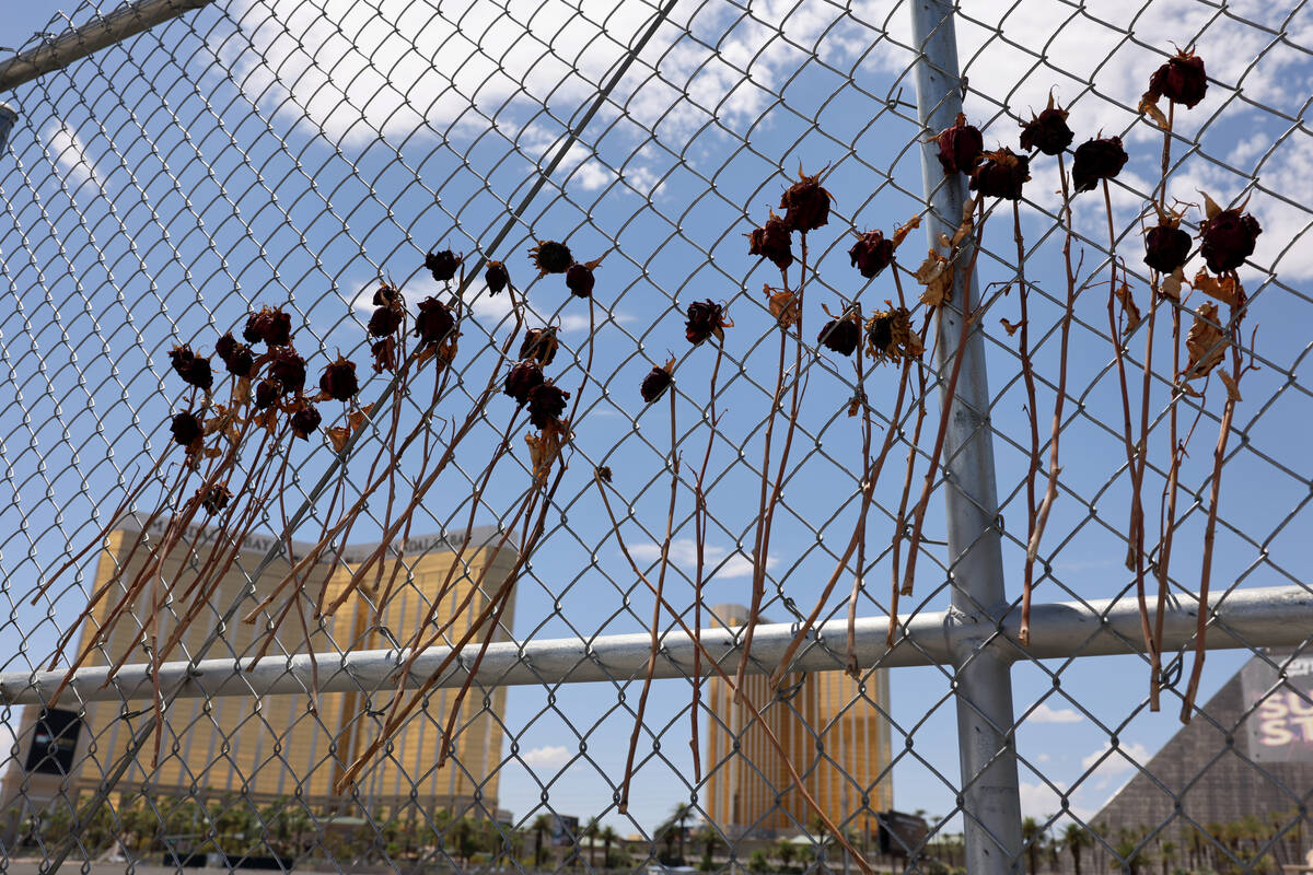 Flowers are seen at the Route 91 Harvest festival shooting site near Reno Avenue and Giles Stre ...