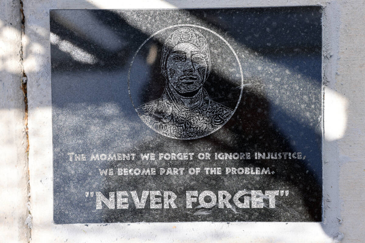 A plaque is seen at the Route 91 Harvest festival shooting site near Reno Avenue and Giles Stre ...