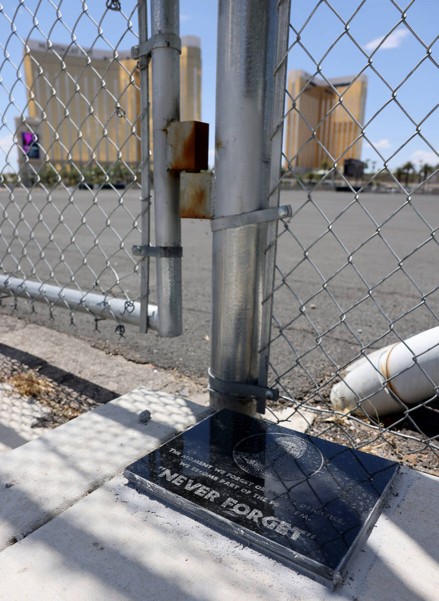 A plaque is seen at the Route 91 Harvest festival shooting site near Reno Avenue and Giles Stre ...