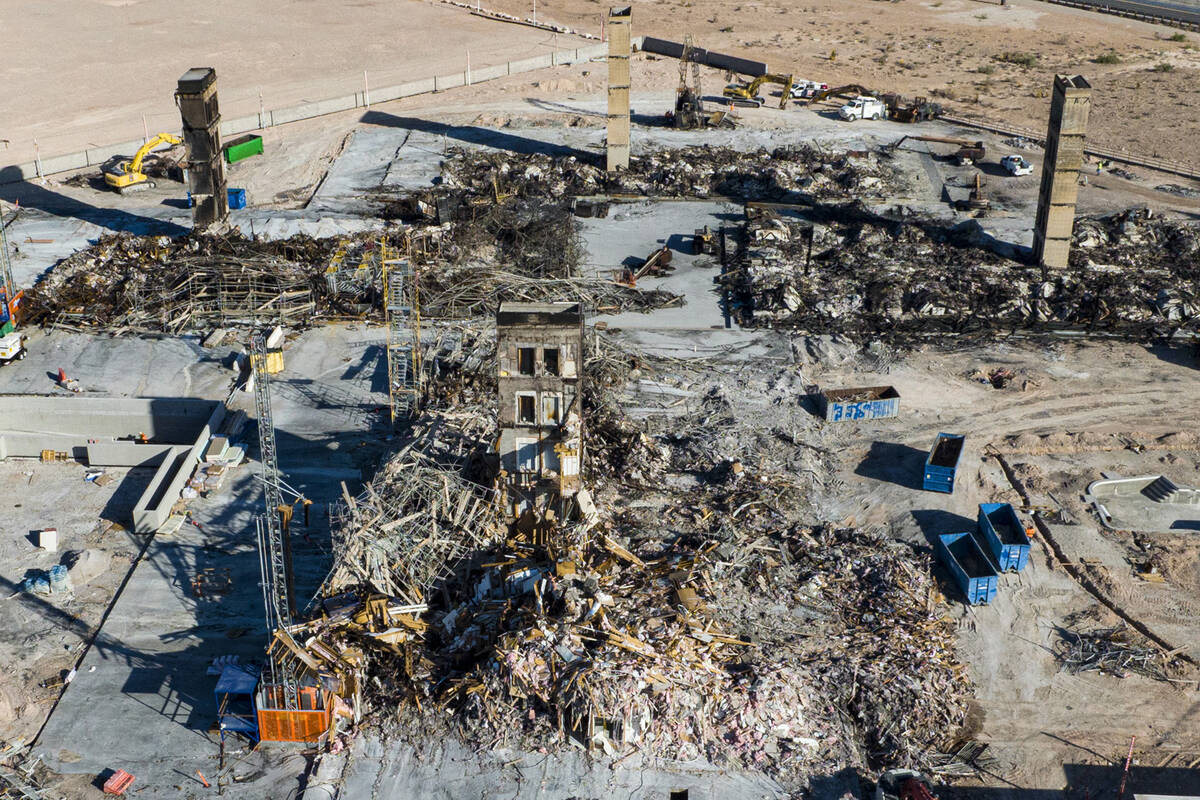 An aerial view shows large piles of debris at the scene where a fire destroyed an apartment com ...