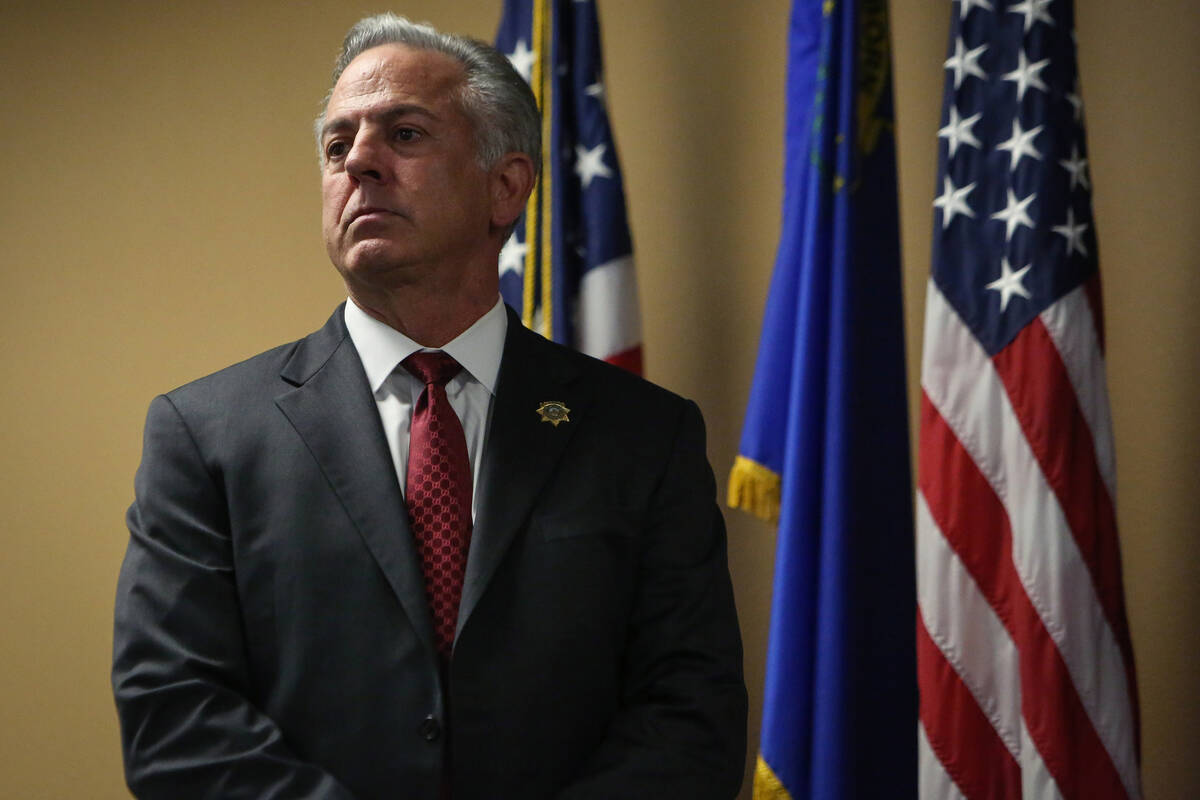 Clark County Sheriff Joe Lombardo stands on stage as he presents various law enforcement with a ...