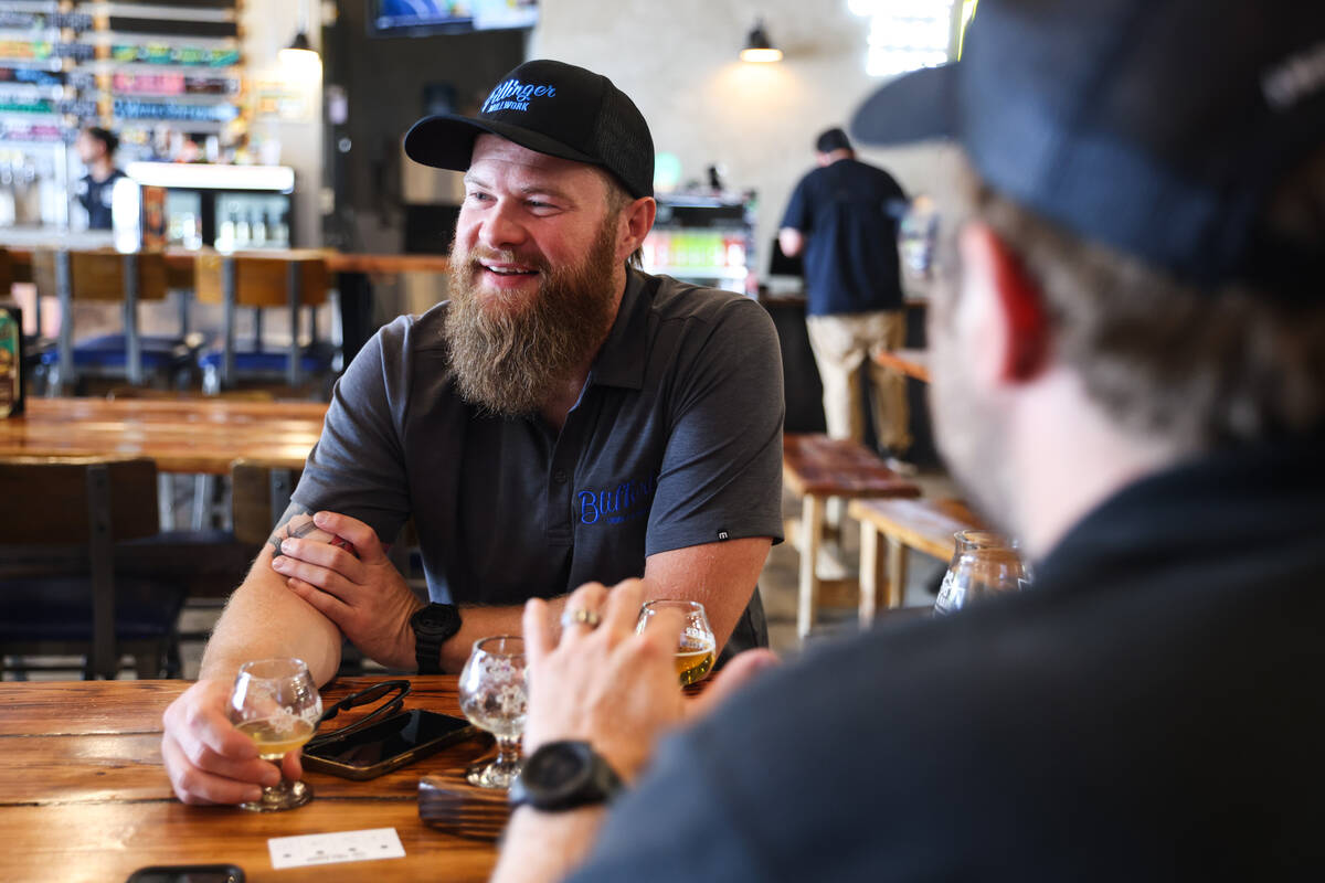 Justin Krall, of Milwaukee, drinks beer with his friends at Able Baker Brewing in the Arts Dist ...