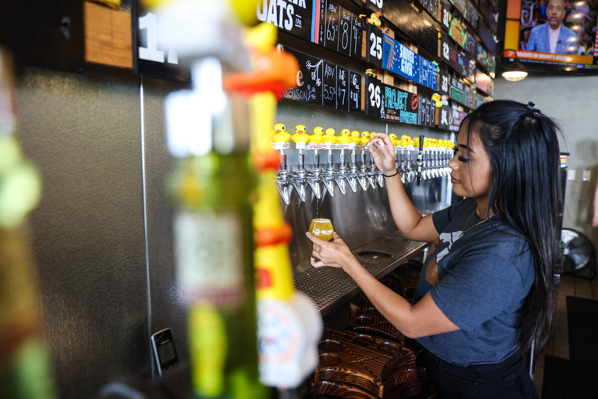Bartender Irish Domingo pours beer at Able Baker Brewing in the Arts District in Las Vegas, Tue ...