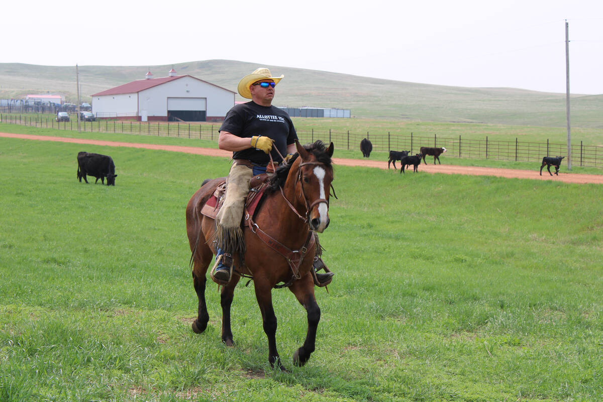 Cattle rancher Todd Hall rides horseback on his ranch near Dunn Center, North Dakota.