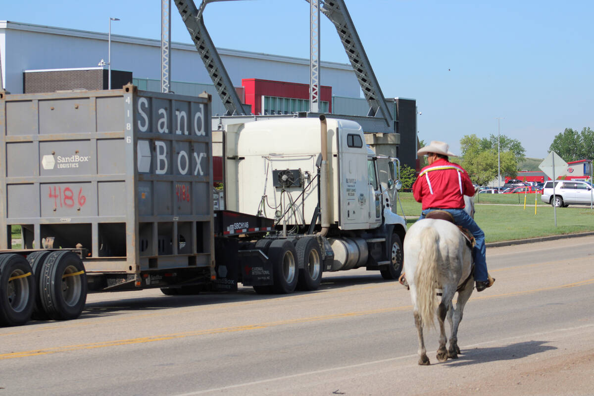 A man from Mandaree, North Dakota, rides horseback at a protest in New Town, North Dakota.