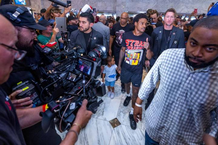 Welterweight boxer Errol Spence Jr., walks in with his son Dallas during grand arrivals inside ...