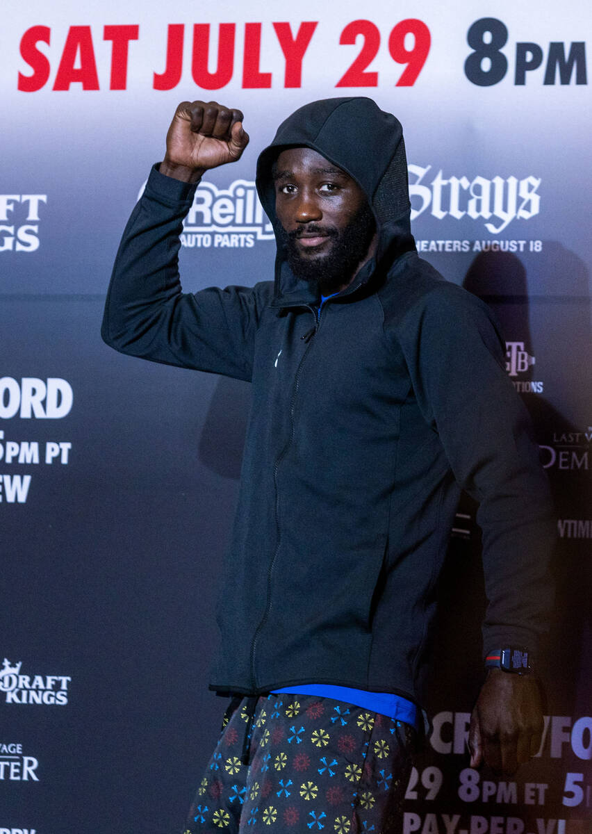 Welterweight boxer Terence Crawford pumps a fist to fans during grand arrivals inside the MGM G ...